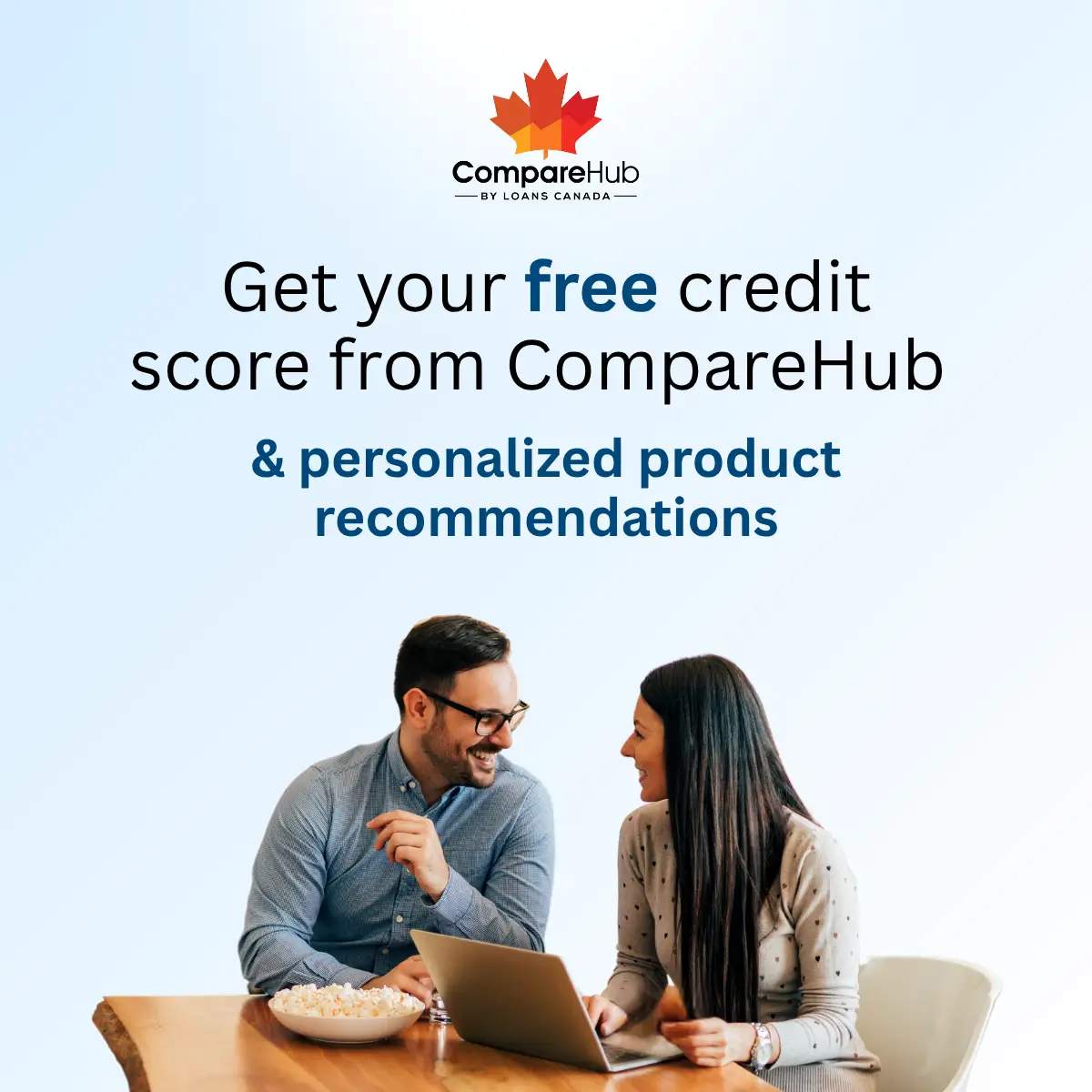 Two people reviewing financial options on a laptop with a CompareHub by Loans Canada banner promoting free credit scores and personalized recommendations.